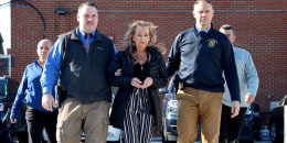 Kimberly Sullivan being taken into custody by police in Waterbury, Conn. 