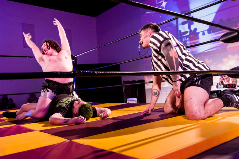 Wrestlers in the ring.