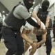 A man identified by Jennifer Vasquez Sura as her husband, Kilmar Abrego Garcia, is led by guards through the Terrorism Confinement Center in Tecoluca, El Salvador. 