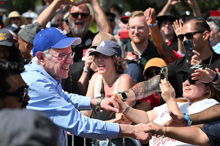 Bernie Sanders shakes hands with supporters