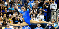 Teammates watch Jordan Chiles compete