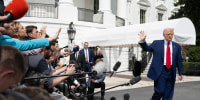 Reporters ask Donald Trump questions.