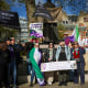 Activists hold placards including "Women are born, not some bloke with a form" and "Women are women, men are men, you can't change sex with the stroke of a pen."