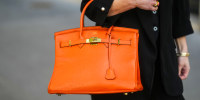 An orange Hermes Birkin bag in Paris on April 9, 2025.