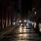 Headlights illuminate cobblestone streets in Old San Juan, Puerto Rico, during an island-wide blackout