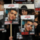 Relatives and supporters hold placards of Israeli hostages, including Edan Alexander, in Tel Aviv on Dec. 30, 2023. 